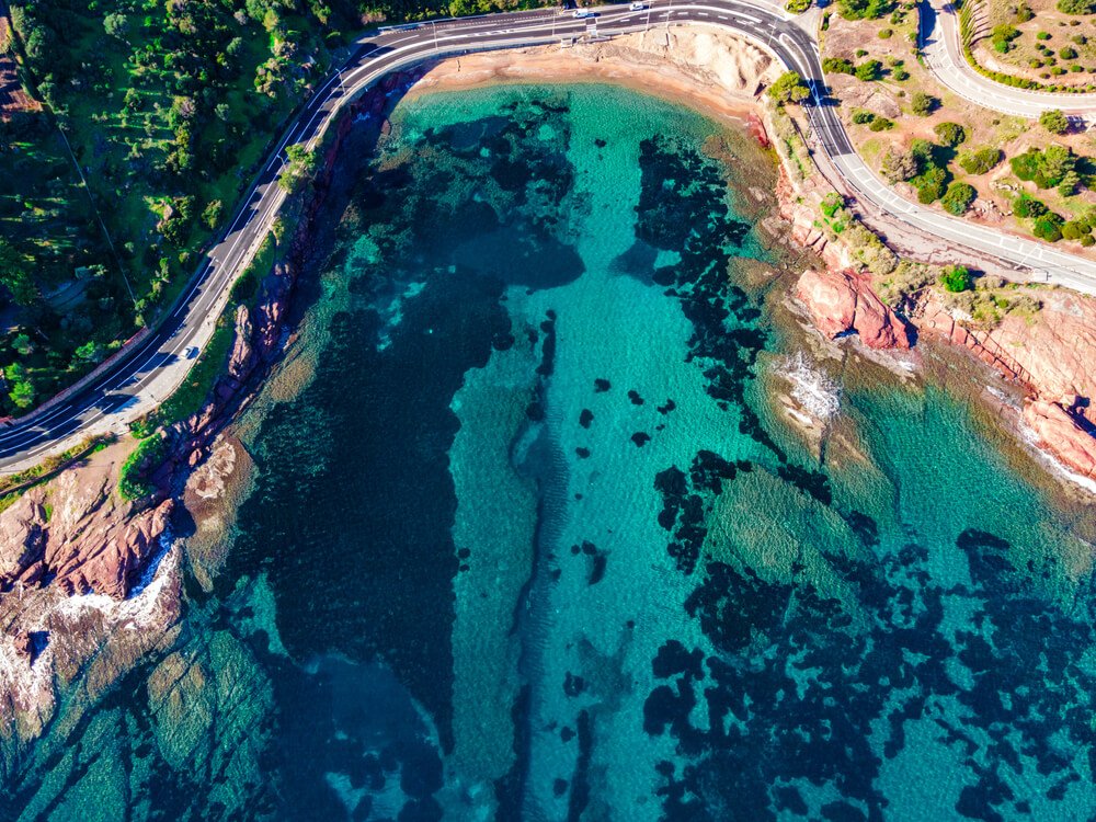 a road in provence coastline with windy roads, seen from an aerial view