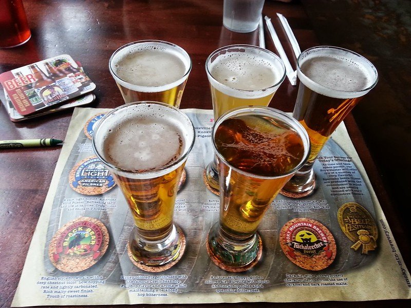 a sample of five different beers at the brewery