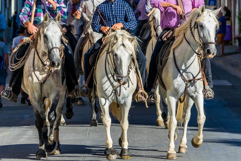 men on horseback during the festivities of the feria