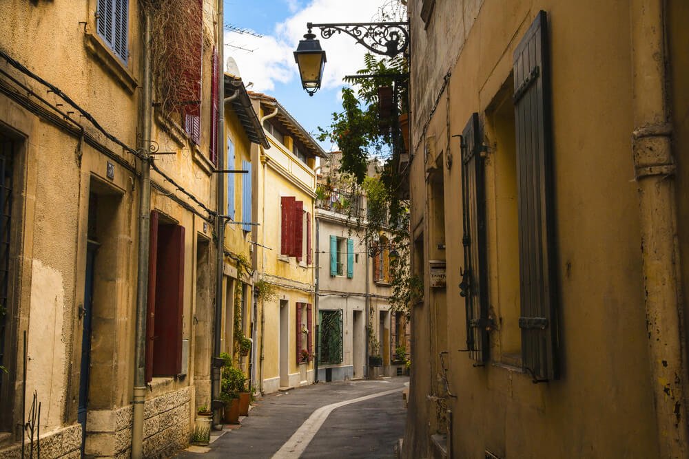 colorful shutters and traditional houses in arles, france