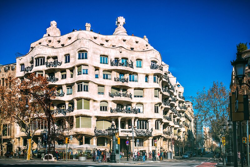 casa de pedrera in barcelona with its wavy facade and stone roof