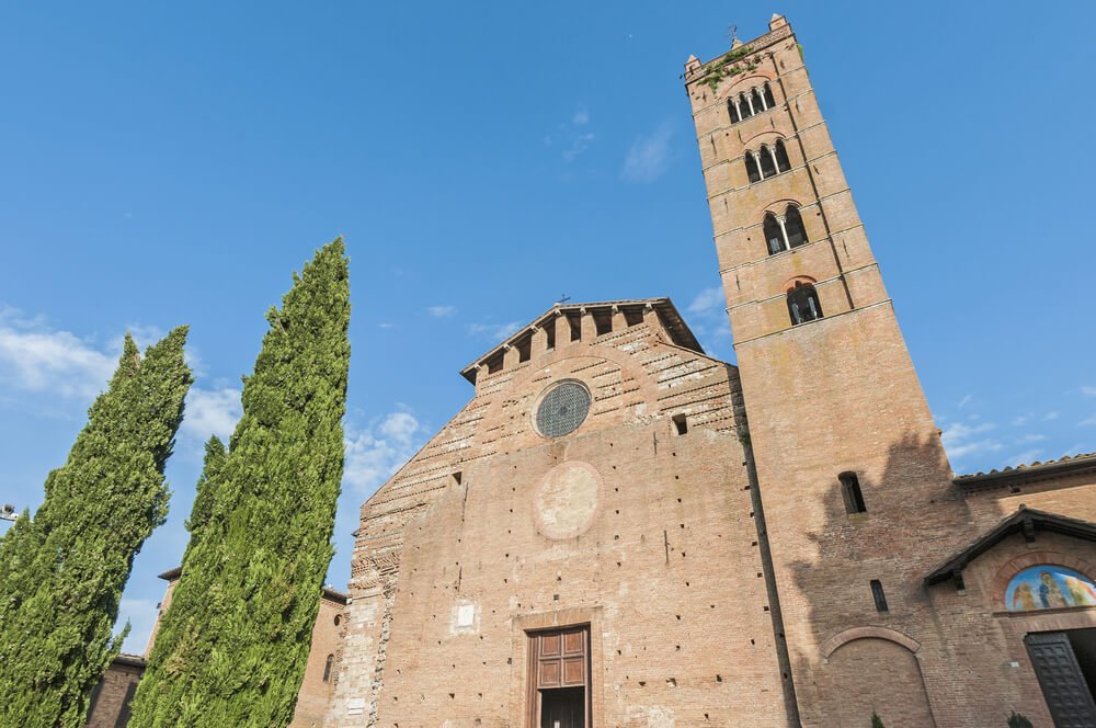 stonework facade of the basilica with a church tower