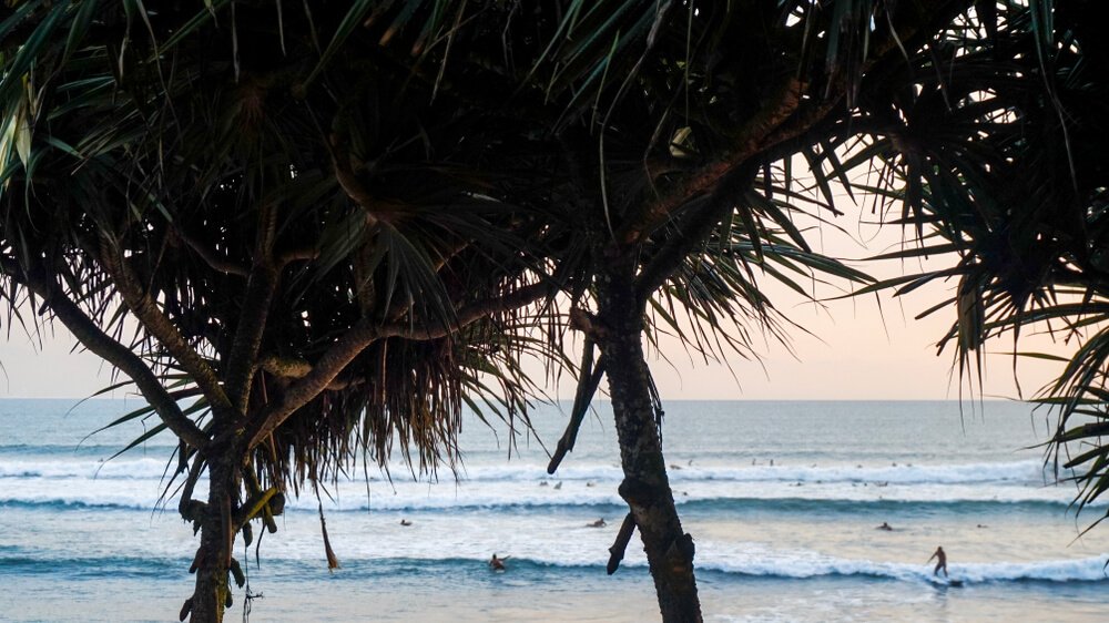 Surfers of all abilities play in the warm waters of Batu Balong, Bali