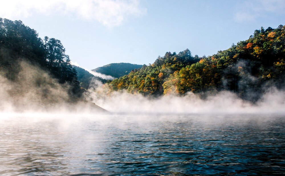 A foggy and misty morning view on Lake Fontana on your Great Smoky Mountains National Park itinerary
