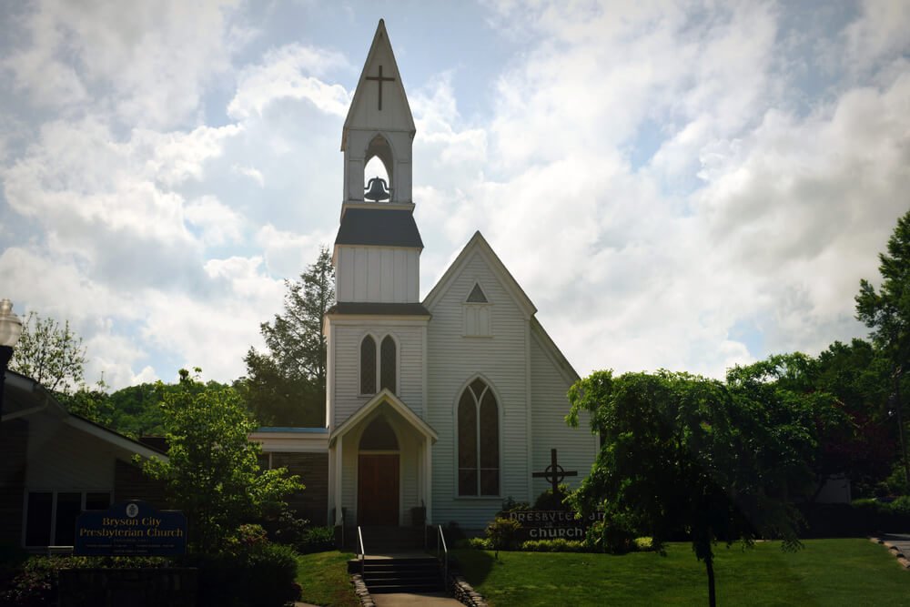 Cloudy day in Bryson City, looking at a white church in Bryson City, North Carolina
