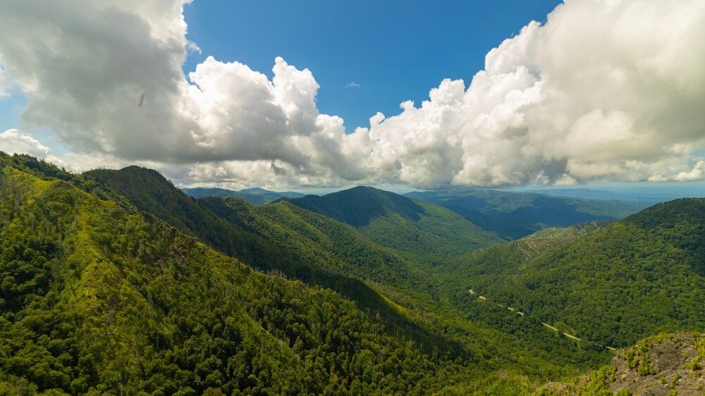 A beautiful view of the green landscape of the epic Chimney Tops hiking trail in Great Smoky Mountains national park