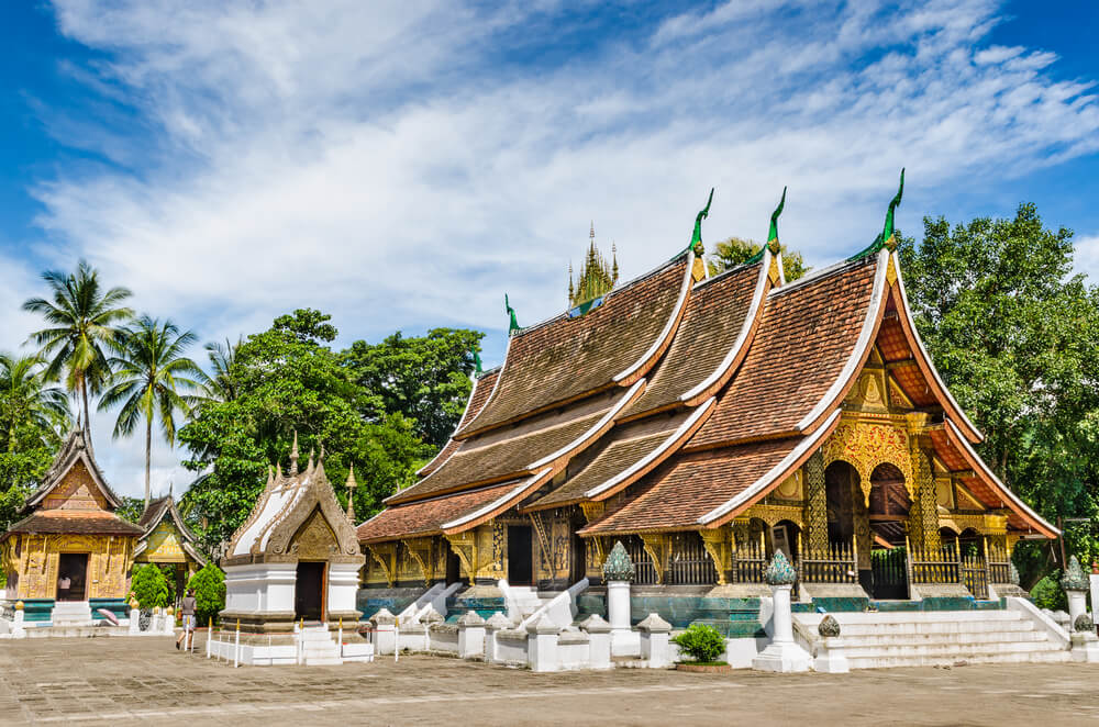 beautiful golden colors of a temple in laos, in the former capital city of luang prabang