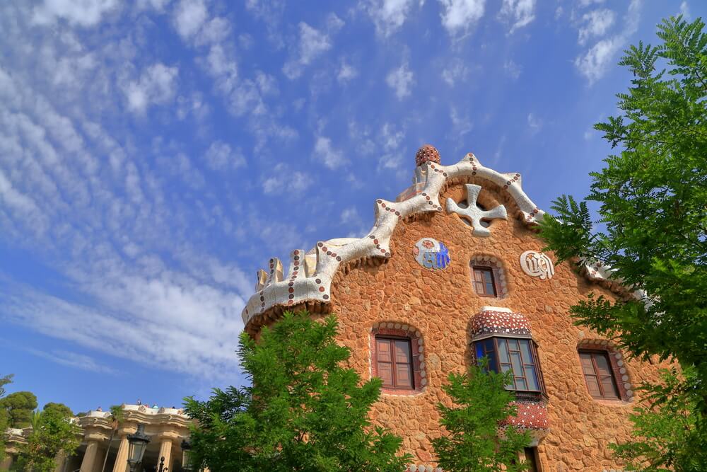 Specific architecture of Casa de Guarda at Park Guell in sunny day, Barcelona, 