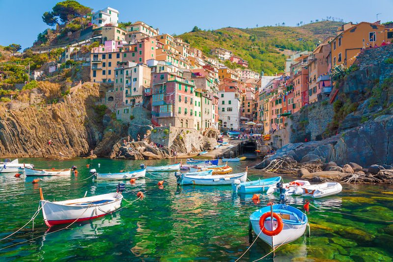 Riomaggiore is the first city of the Cique Terre sequence of hill cities, Liguria, Italy. It has a small dock that provides a good perspective of the fishing village which is nestled in a cove.