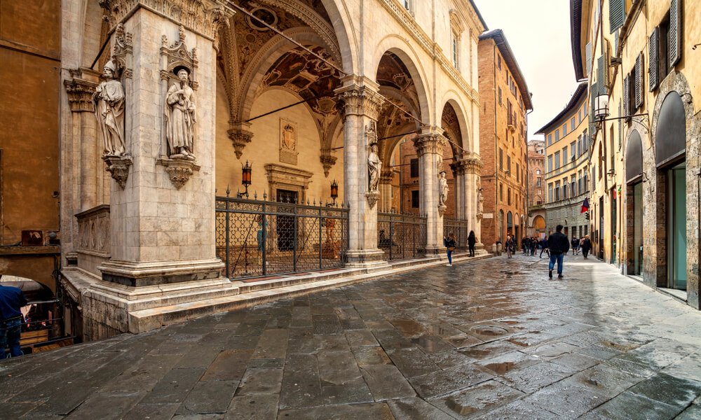 Old medieval streets of Siena, with arches, cobblestone, and beautiful architecture