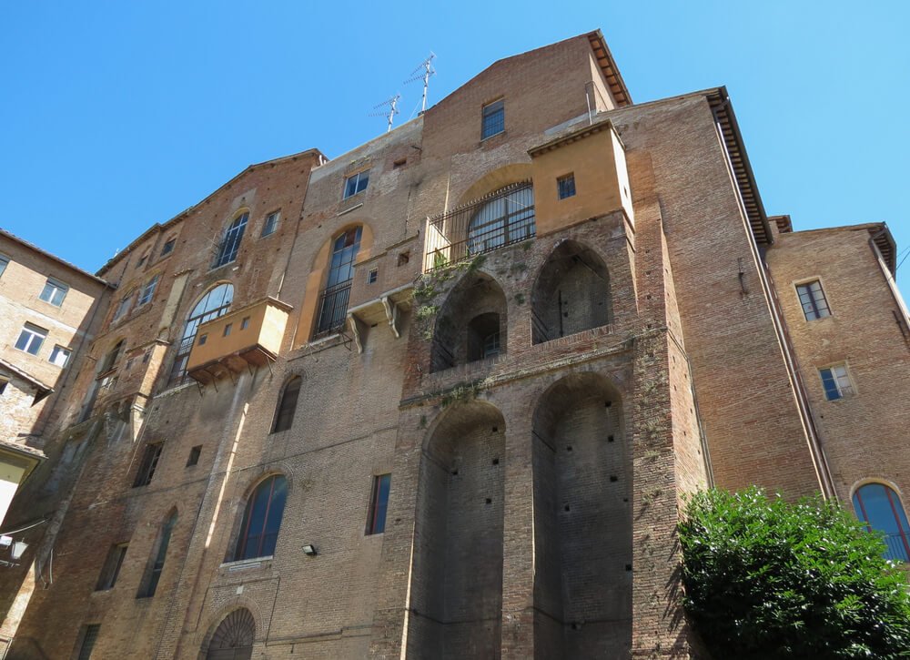 The exterior of the museum that is now housed in Ospedale di Santa Maria della Scala, which was a medieval hospital 
