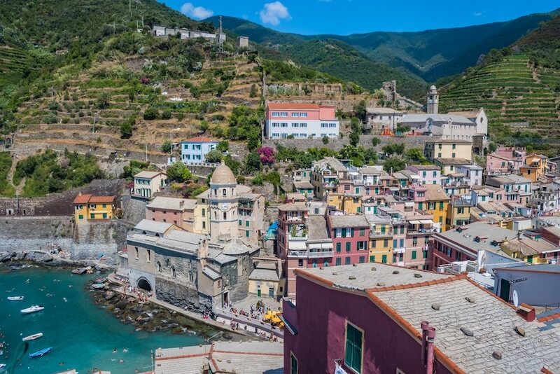 Beach, alongside the colorful village of Vernazza, with a view of the Church of St. Margaret of Antioch 
