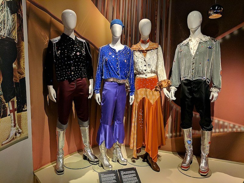 Four costumes on mannequins that represent ABBA group as seen at the museum dedicated to them.