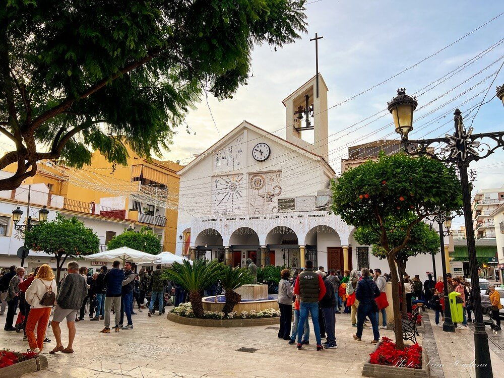 The popular town in Andalusia's Costa del Sol in the winter, with Christmas lights and people in their warm weather attire enjoying this warm winter Europe getaway