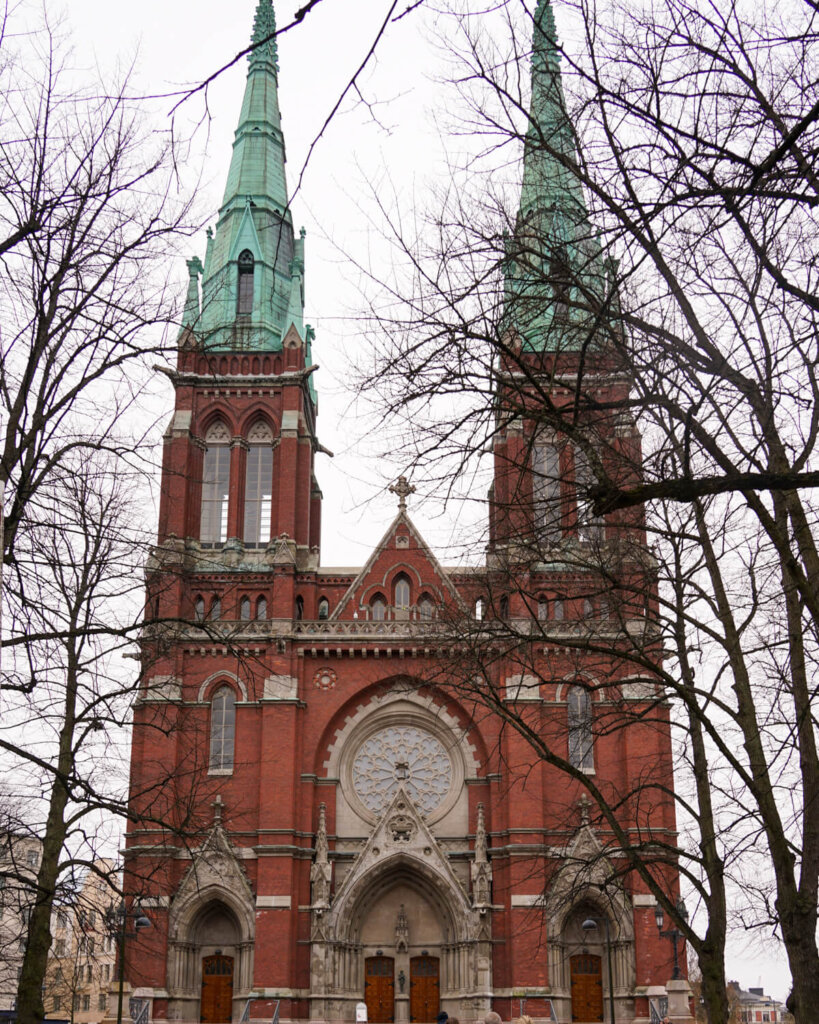 View of a Helsinki church in the winter with bare trees on a March visit