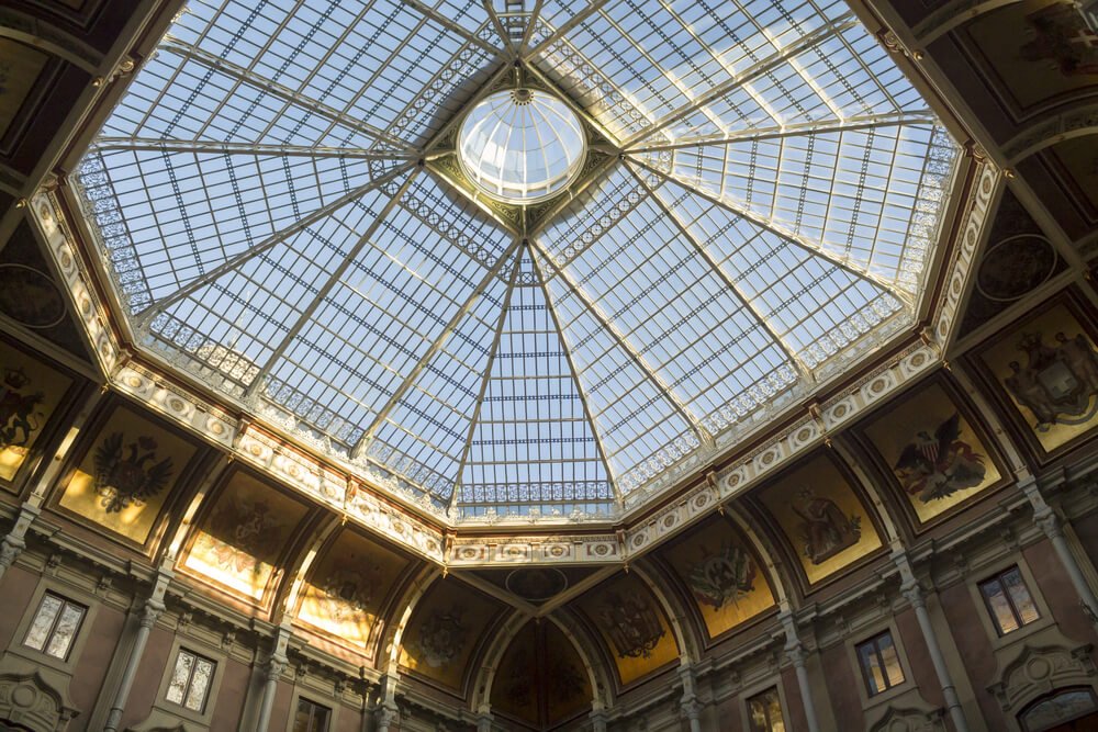 Interesting window feature inside the Palacio da Bolsa with a skylight in ornate glass and molding on the ceiling detail