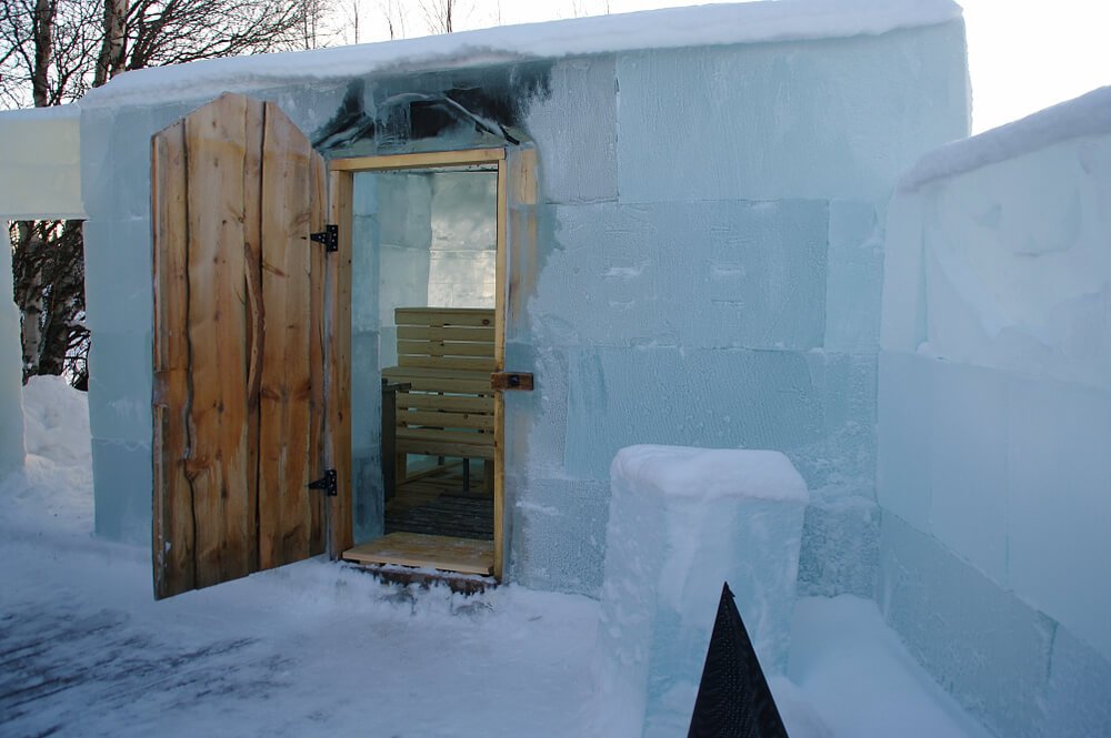 The unique construction of a snow sauna in Finland where it is a sauna covered by ice that is heated up to high temperatures yet does not melt the ice