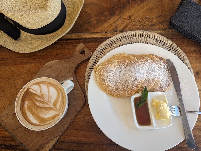 Coffee, pancakes, sunhat, at a breakfast in Fiji