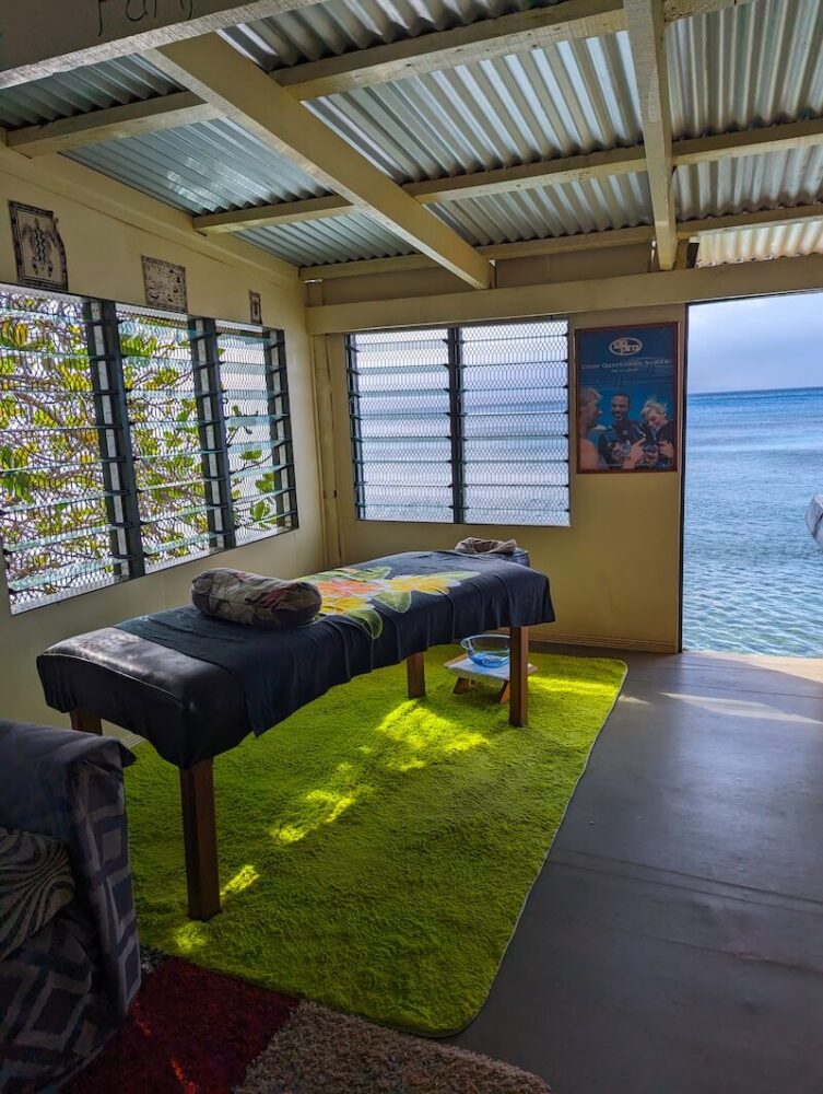 massage table in a room with an ocean view in taveuni