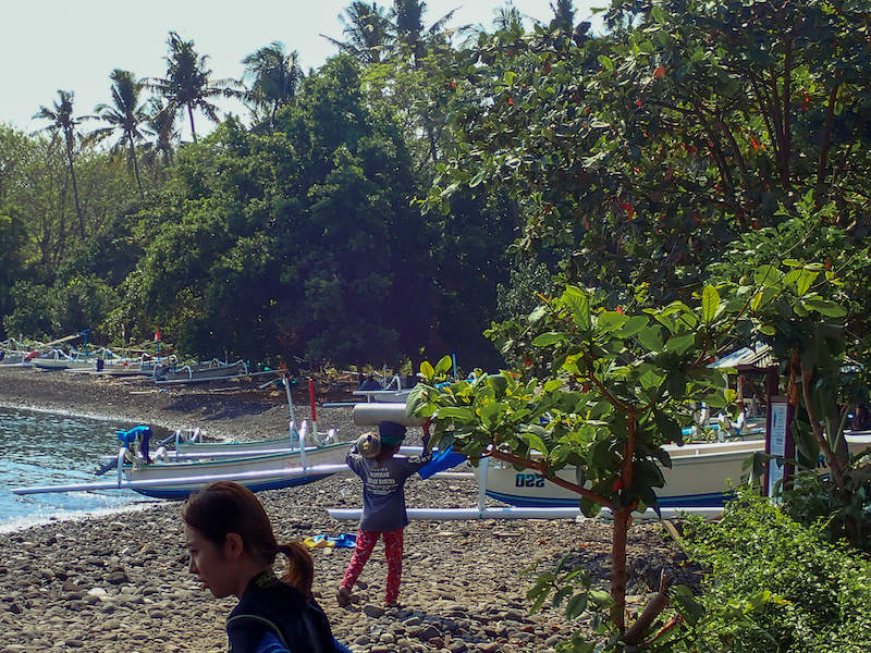 Tulamben area beach with people walking around