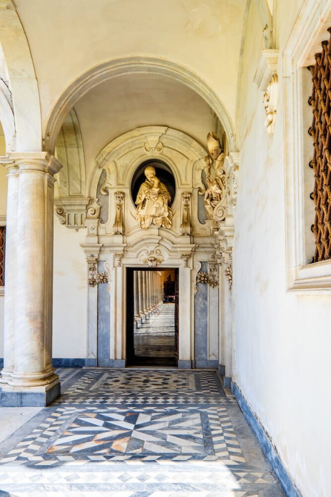 Beautiful cloister in the Vomero Hill area with ornate arches and doorways in the building