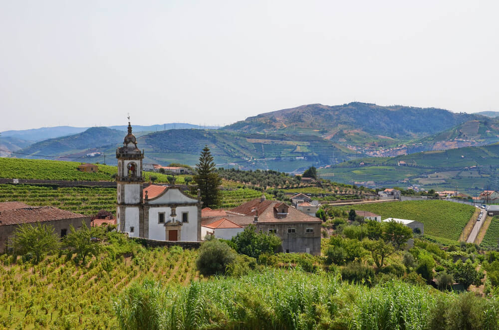 Vineyards in the town of Peso da Regua overlooking church as seen from one of the viewpoints in town