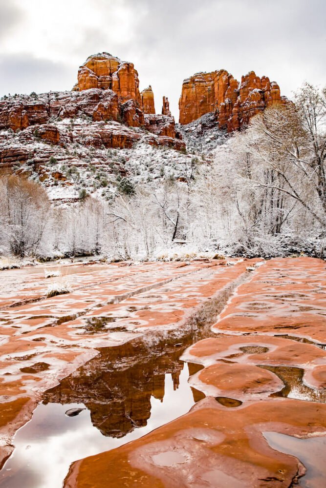 An icy trail leading to the beginning of a popular Sedona hike, imploring people to take caution while hiking in Sedona in winter and wear proper footwear