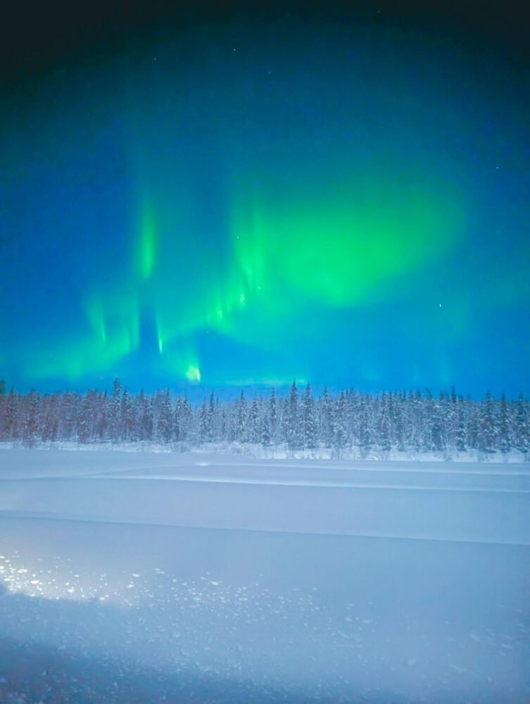 Aurora display in Rovaniemi Finland with the green lights pulsating overhead