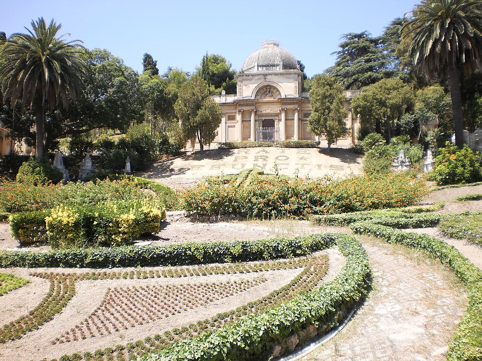 The monumental cemetery in Messina with rows of hedges, plants, and monuments like tombstones etc.