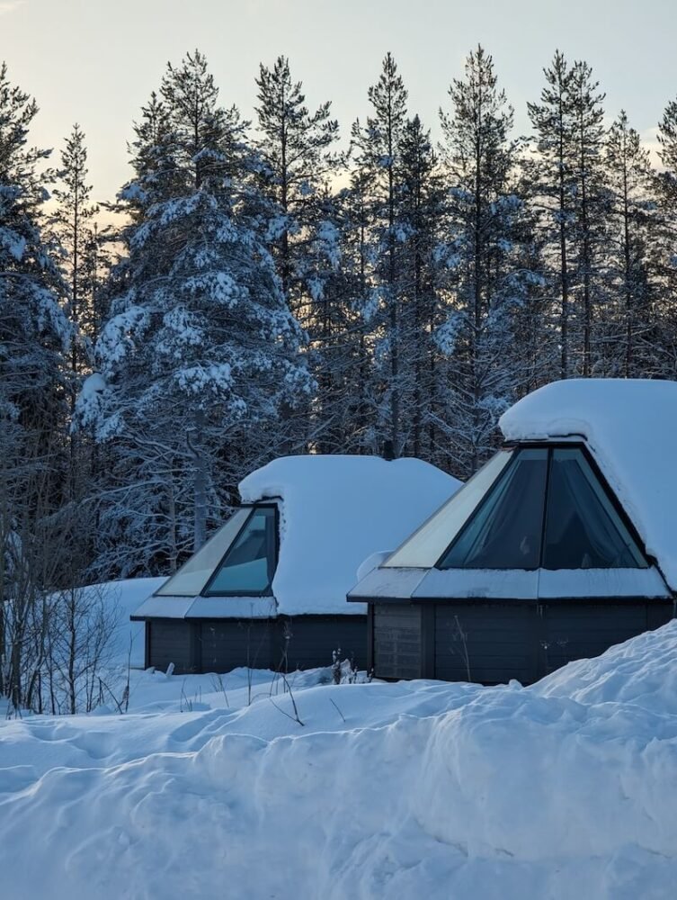 Igloo hotel of Apukka with two igloos visible in the golden afternoon light of rovaniemi in winter