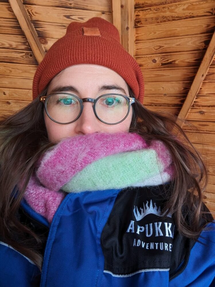 Allison Green bundled up and wearing the gear from the Apukka resort before dog sledding