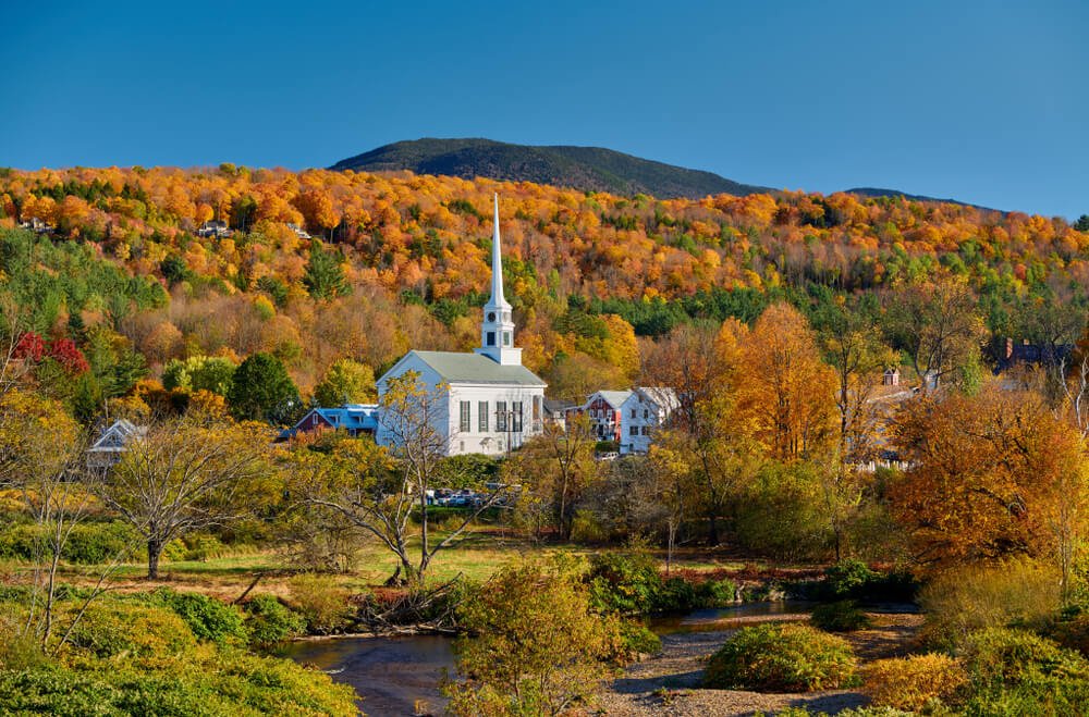 Fall foliage and white church in vermont