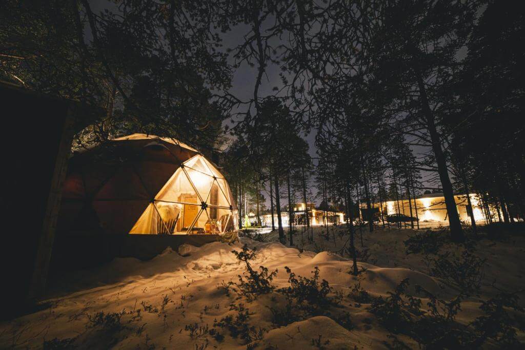 view of the aurora dome all lit up at night with golden glow