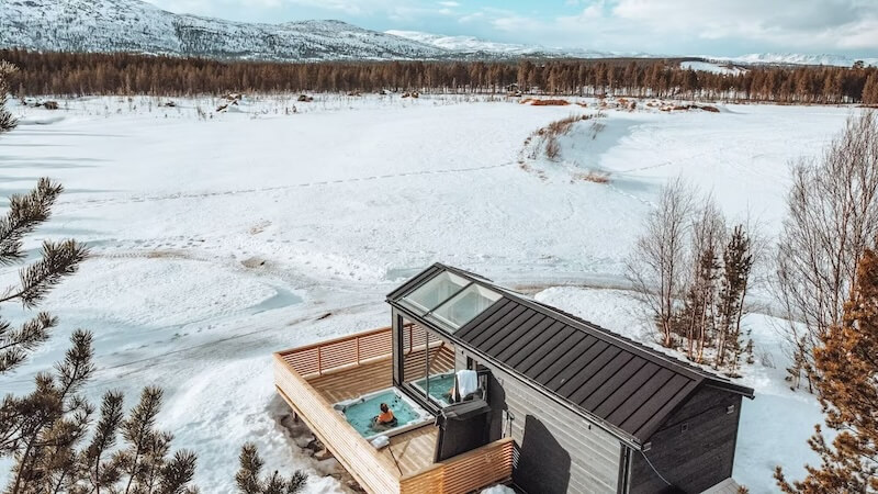 A person in a hot tub in this Alta lodge