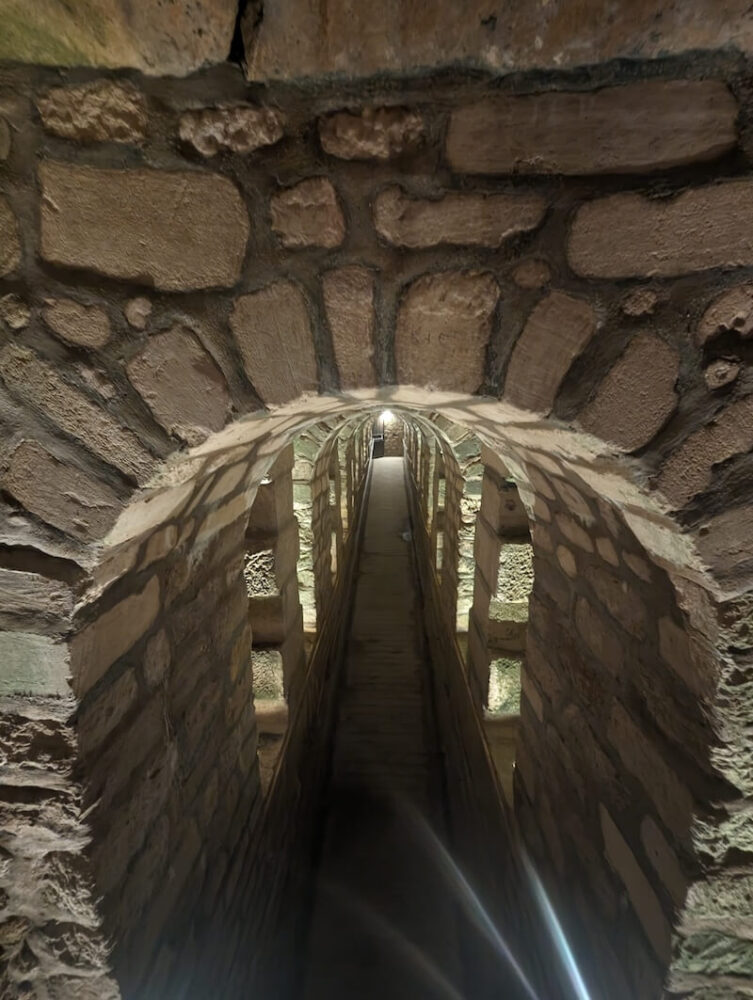 The catacombs leading to a tunnel passing through the underground