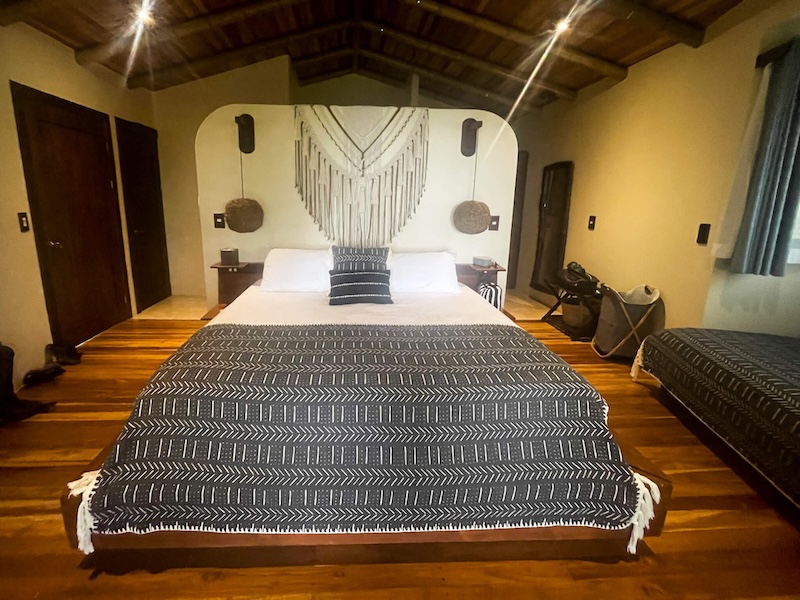 The large bed and daybed in the main bedroom