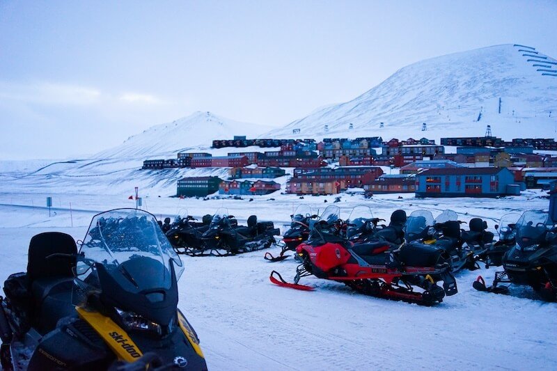 Snowmobiles in front of the town of Longyearbyen in summer