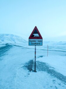 the warning sign about polar bears just outside of the town of longyearbyen