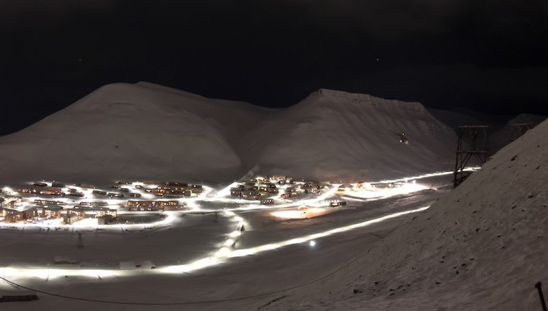 True pitch black darkness in Longyearbyen during the polar night with very little lit up and visible in the dark night sky