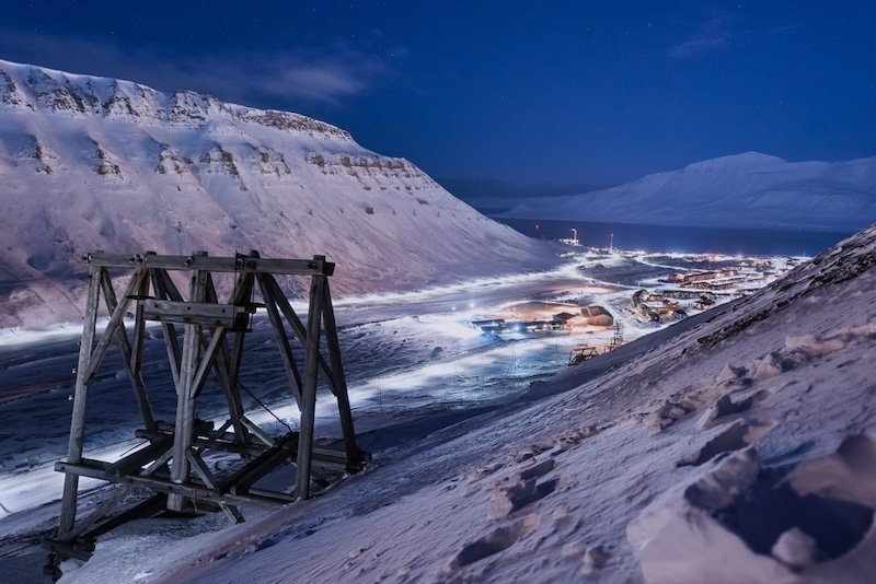 Another dark period over the town of longyearbyen as seen from a vantage point near an old dismantled mining area