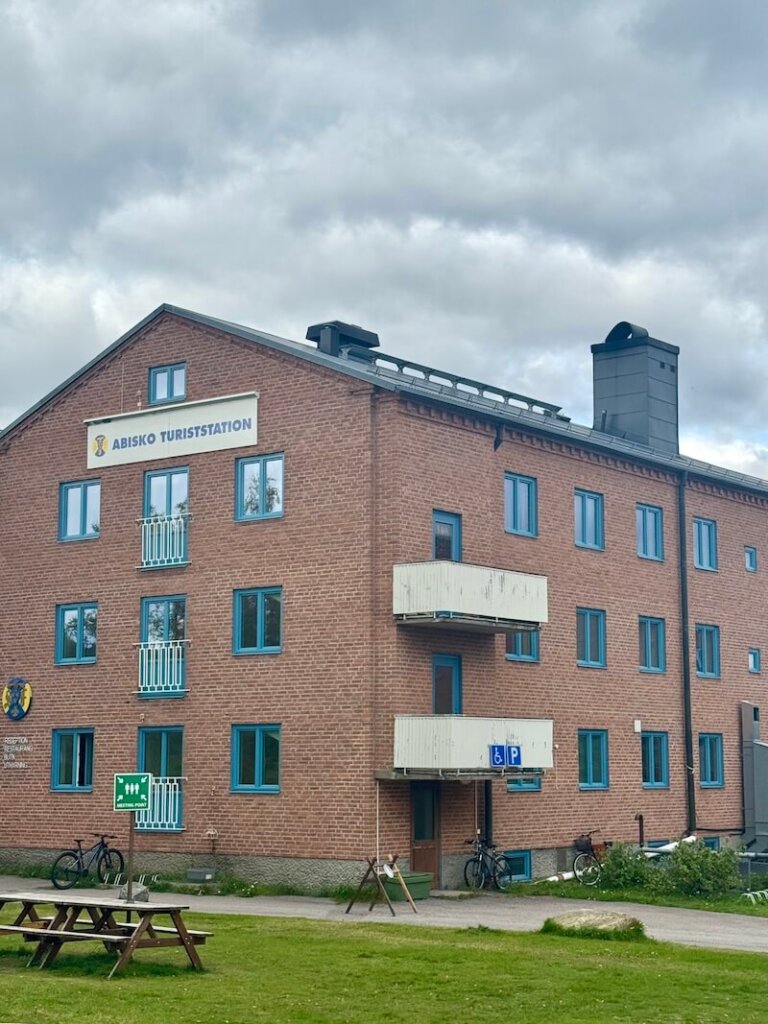 Abisko Turiststation building in the autumn, with green grass and no snow on the ground