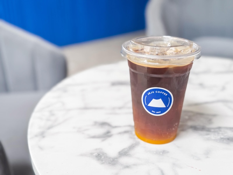 an orange americano in jeju coffee in kuala lumpur