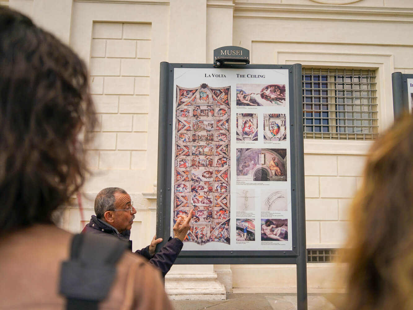 Tour guide passionately explaning the Sistine Chapel's art history