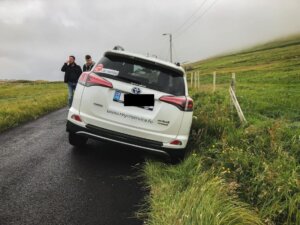 A car in a ditch in the faroe islands