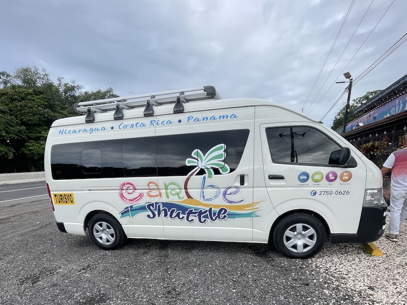 Caribe shuttle on gravel at a parking lot in Costa Rica on the way to Bocas del Toro