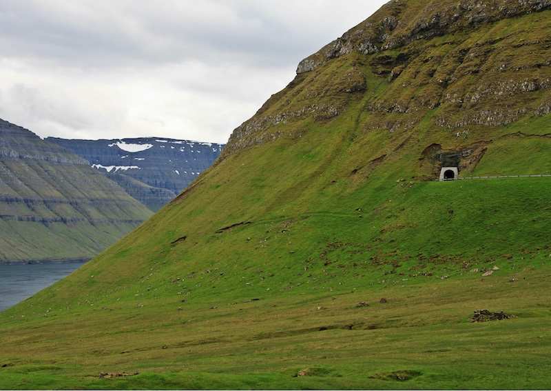 A one lane tunnel on a road in Kalsoy, Faroe Islands