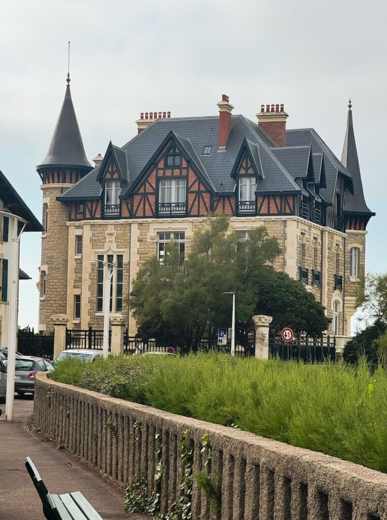 The famous Villa Belza in Biarritz with medieval inspired architecture and lots of stonework with some exposed timber work on the top level of the house, with a chateau spire. This is an icon of Biarritz's architecture but it is now a private residence.
