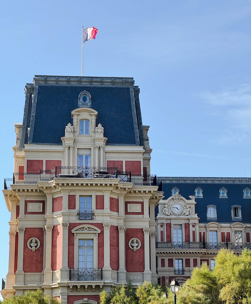 Details of the former imperial palace now a hotel in Biarritz with lovely architecture and French flag