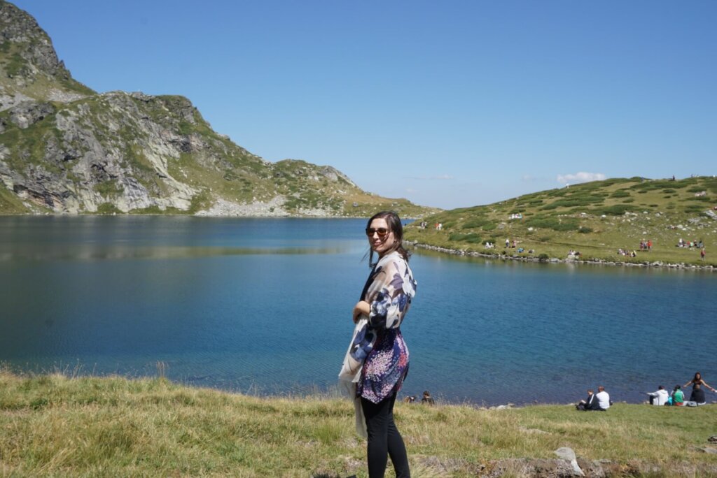 Allison Green in front of one of the Rila Lakes