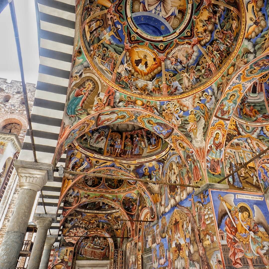 The dramatic paintings on the exterior of Rila Monastery's main chapel's arches